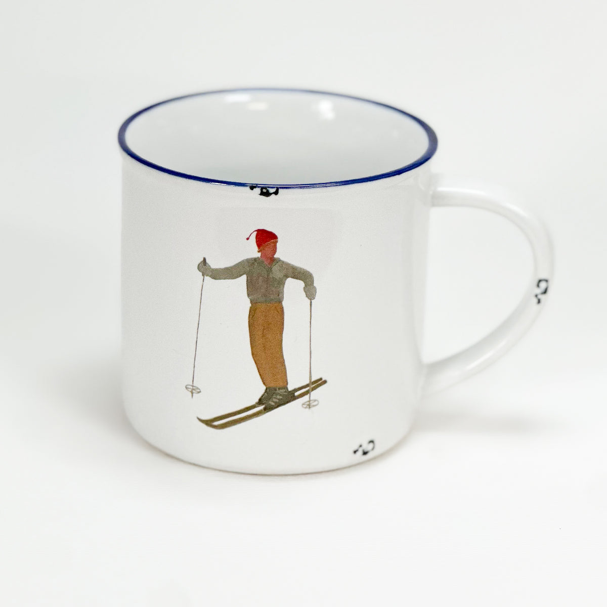 Vintage Keramiktasse im Emaille-look mit einem Skifahrer im Stand
