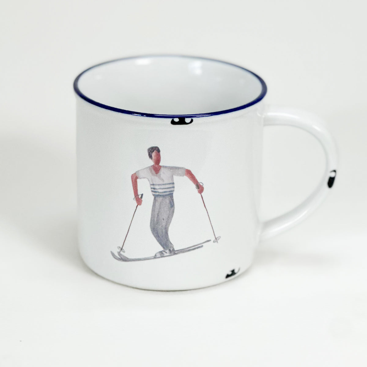 Vintage Keramiktasse im Emaille-look mit einem Skifahrer im Stil Alfons Walde